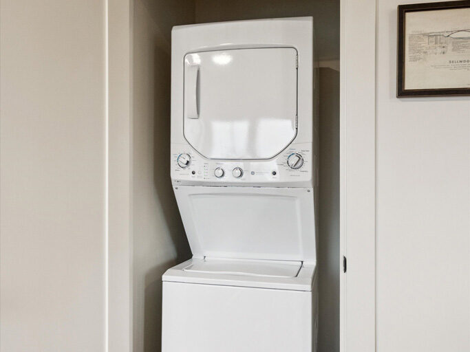 Stacked laundry in the 2nd story ADU with garage underneath, contemporary styling